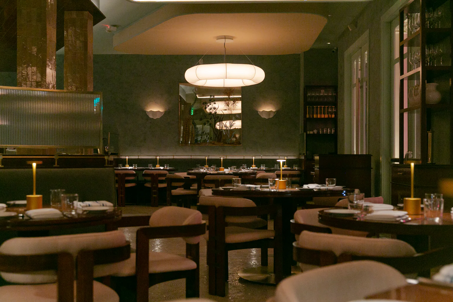 The saturated pink and blue dining room inside Saltie Girl Los Angeles.
